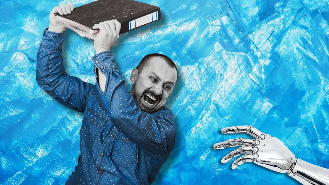 Man in a blue shirt raises a thick binder toward an outstretched chrome robot hand against an icy blue background.