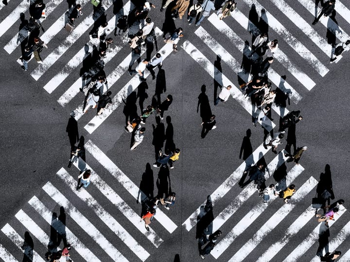 Black and white stripe pedestrian crossing that is X shaped